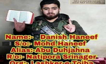 Picture of Srinagar youth holding Quran in one hand, gun over shoulder surfaces on social media