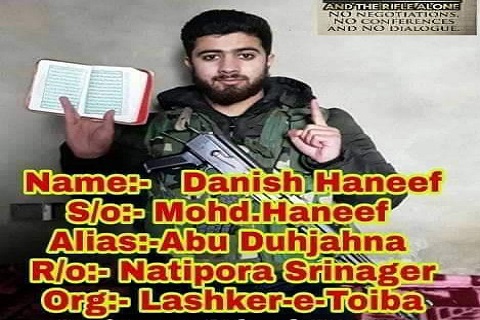 Picture of Srinagar youth holding Quran in one hand, gun over shoulder surfaces on social media