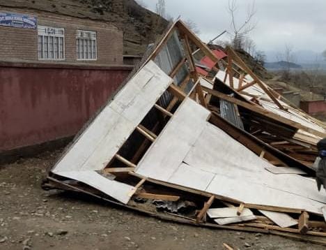 Gusty winds damage rooftop of school building in Bijbehara