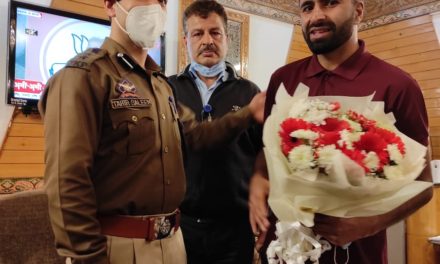 Cyclist Adil returns home, after feat “Director AAI Srinagar, SSP Budgam receive him at Airport