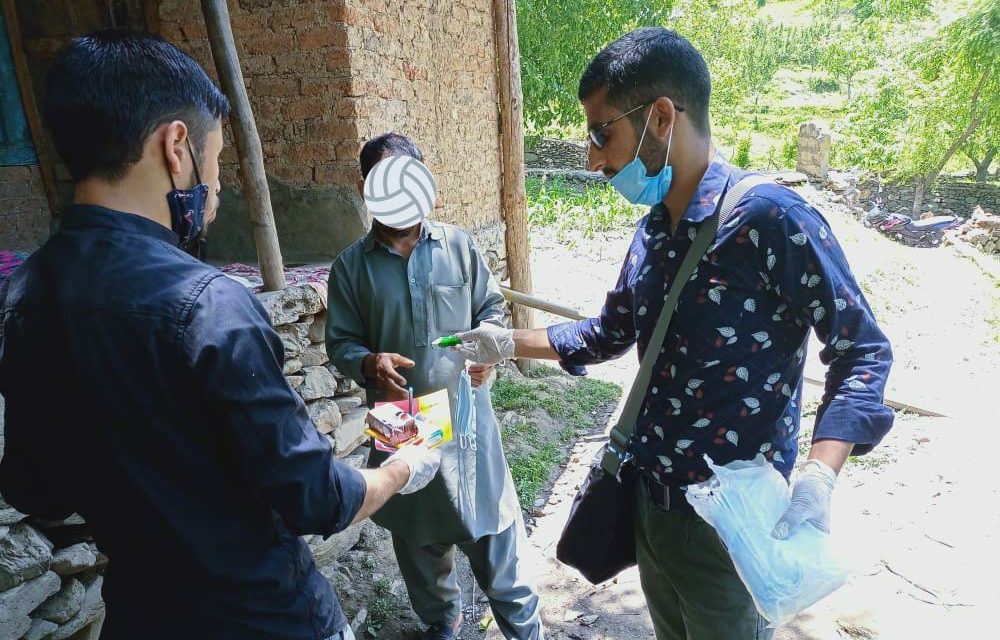 Amid COVID-19, 2 college students in Tral distribute food items, masks, books, and stationery items among needy people
