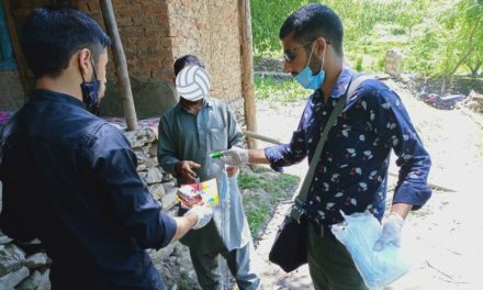 Amid COVID-19, 2 college students in Tral distribute food items, masks, books, and stationery items among needy people