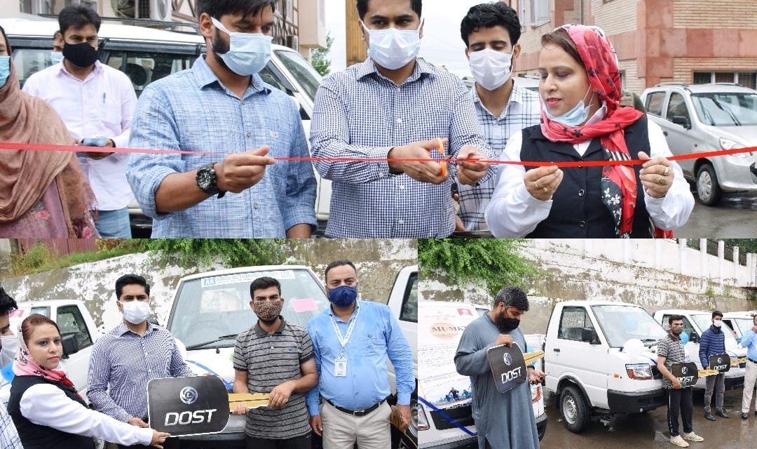 DC Bandipora hands over commercial vehicles to beneficiaries under Mumkin Scheme
