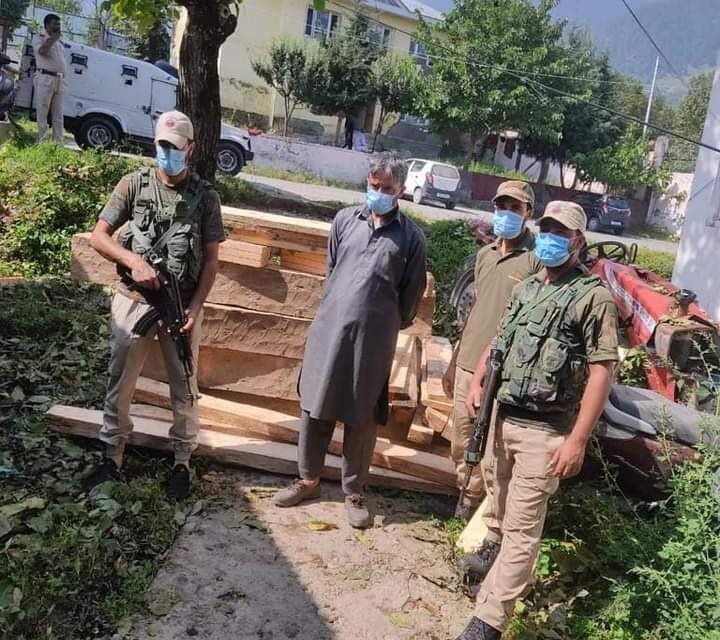 Budgam Police recovered huge quantity of illicit timber in Khag Budgam,accused arrested