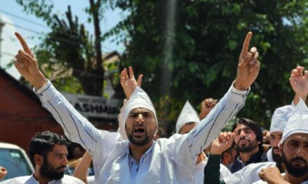 Protest by F&ES aspirants wearing shrouds in Srinagar press enclave