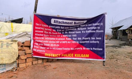 District Police Kulgam attaches property of notorious drug peddler in Kulgam