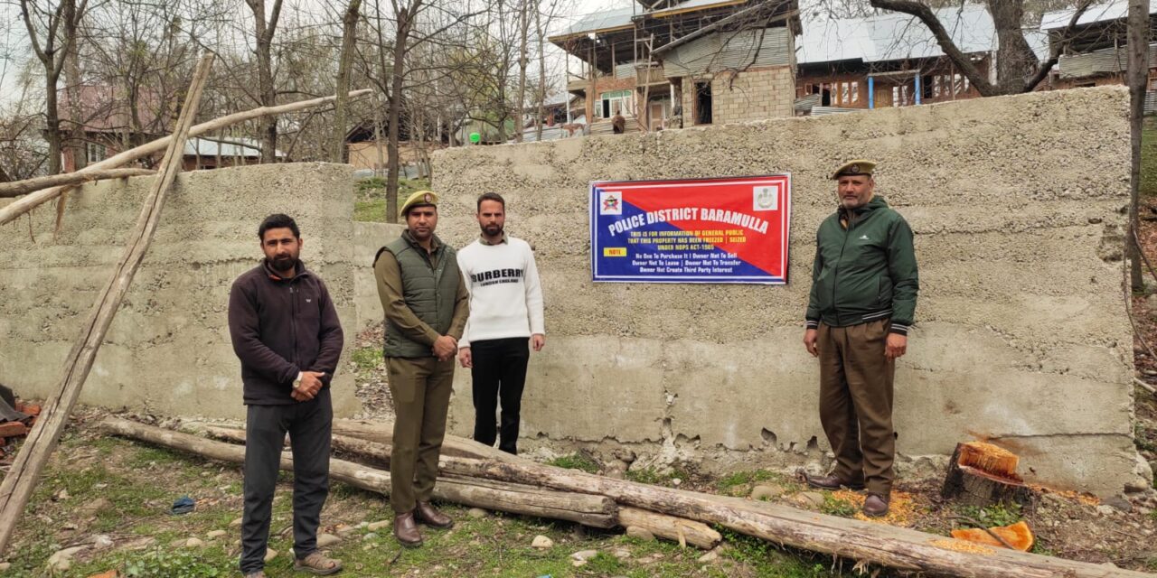 Police attaches illegally acquired property of notorious drug peddler in Baramulla