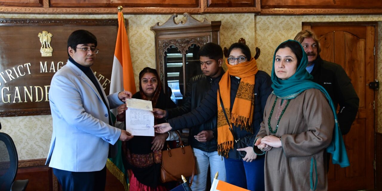 DC Ganderbal disburses death compensation to dependents of workers