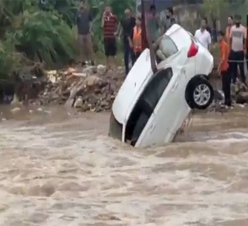 Car swept away by heavy water flow rescued in Kathua